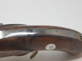 an old gun that is sitting on top of a table