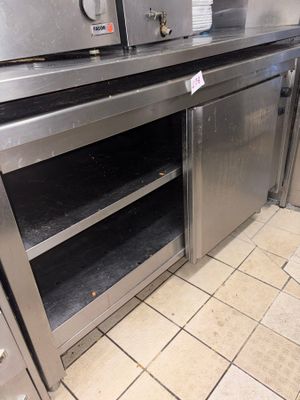 a stainless steel kitchen with two ovens in it
