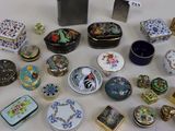 many different types of decorative boxes on the table