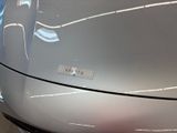 a close up of a car ' s headlight and front bumper