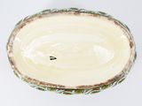a white bowl with a blue and green design on it