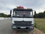 a white truck that is parked on the side of the road