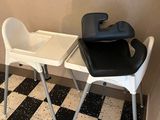 two chairs and a table in the corner of a room