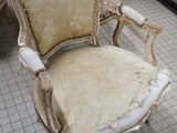 two chairs that are sitting on a tile floor