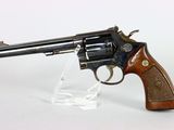 gun on a clear stand on a white background
