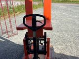 a forklift with skis on it sitting on a pallet