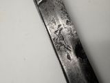 a knife with a bird on it on a table