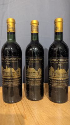three bottles of wine sitting on top of a wooden table