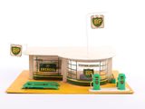 a small model of a gas station with a gas pump