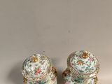 pair of chinese porcelain vases on stand with gold accents
