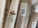 many different types of disposable paper cups in the bag