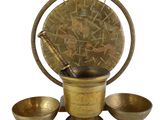 an image of a brass mortar set with three bowls and a wooden spoon