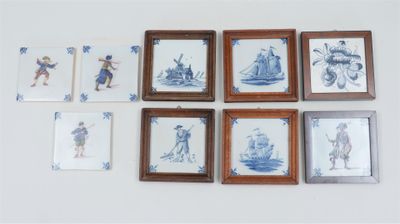 six framed pictures on the wall of a room