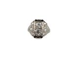 a close up of a diamond ring on a white background