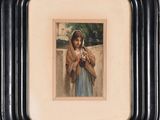 painting of a woman holding a cat in a black frame on a shelf