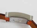 a close up of a watch on a white surface
