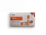 un gros plan sur un tube de dentifrice posé sur une surface blanche