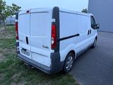 a white van that is parked on the side of the road