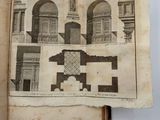 an old book with a picture of a building on it