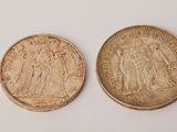 two british coins, one of which is a sovereign and one of which is a sovereign