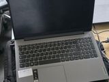 a laptop computer sitting on top of a wooden desk