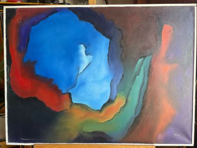 painting of a blue, red, and green abstract painting on a wooden easel