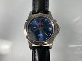 an image of a close up of a wrist watch on a table