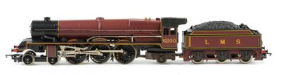 a toy train on a white surface with a white background