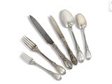 four forks and a knife on a white surface