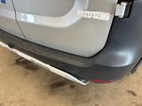 the rear end of a car with a sticker on it ' s bumper