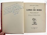 un livre ouvert dont une page est écrite à la main en français