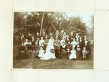 a black and white photo of a group of people posing for a picture
