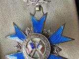 a blue ribbon and a silver medal in a black box