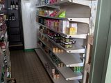 many shelves in the store that have food on them
