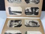 an old photo of an open book with pictures of buildings