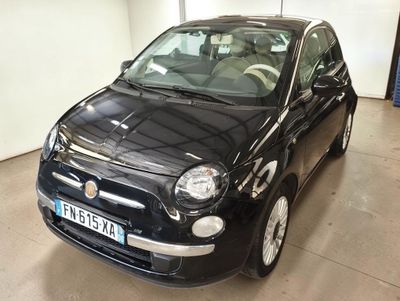 a small black car that is parked in a garage