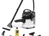 un aspirateur noir et blanc avec des accessoires de nettoyage sur fond blanc
