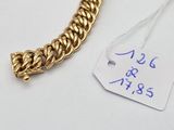 a gold chain with a tag attached to it