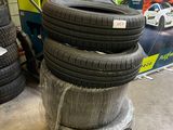 many tires stacked on top of each other in a warehouse