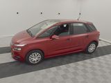 a picture of a red car parked in a garage