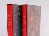 two books that are sitting side by side on a white surface