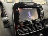 the dashboard of a car with a microphone in the center of it