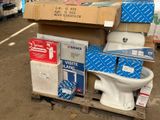 a white toilet sitting on top of a pallet in a warehouse