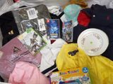 a box full of children ' s clothing and toys in it