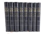 a set of six black books with gold lettering on them