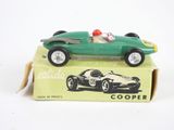 a green toy car sitting on top of a box