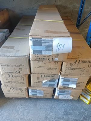 many boxes stacked on top of each other in a warehouse