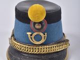 a blue hat with a gold chain around it