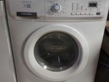 a washer and dryer sitting next to each other in a room