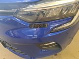a close up of a blue car with a sticker on it